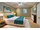 Bedroom with a bed, rug, natural light, bedside table, and a dresser at 1275 Fairfax St, Denver, CO 80220