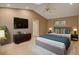 Nicely decorated main bedroom with furnishings, ceiling fan, and light hardwood floors at 1275 Fairfax St, Denver, CO 80220