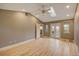Spacious main bedroom featuring ceiling fan, skylight, hardwood floors, and french doors at 1275 Fairfax St, Denver, CO 80220