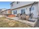 Backyard patio with furniture, fire pit, and hot tub perfect for outdoor entertaining at 12362 Nate Cir, Parker, CO 80134