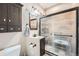 Bathroom featuring a glass-enclosed shower, dark wood vanity, and modern fixtures for a luxurious feel at 12362 Nate Cir, Parker, CO 80134