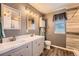 Bathroom with a double sink vanity, updated lighting, and modern fixtures for a spa-like experience at 12362 Nate Cir, Parker, CO 80134