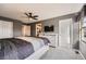 Primary bedroom with three doors, tv, and a comfortable bed at 12362 Nate Cir, Parker, CO 80134