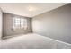 Bedroom with grey walls, carpet, and a window with sheer curtains at 12362 Nate Cir, Parker, CO 80134
