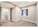 Finished basement bedroom with neutral carpet, light grey walls and a window with curtains at 12362 Nate Cir, Parker, CO 80134