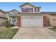 Charming two-story home featuring a large garage and red shutters at 12362 Nate Cir, Parker, CO 80134