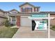 Charming two-story home with red shutters, attached garage, and manicured front lawn at 12362 Nate Cir, Parker, CO 80134