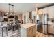 Open-concept kitchen featuring stainless steel appliances and a center island at 12362 Nate Cir, Parker, CO 80134