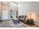 Bright living room with high ceilings, neutral tones, and modern furnishings at 12362 Nate Cir, Parker, CO 80134