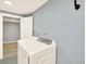 Laundry room featuring a white washer and dryer at 2046 S Quitman St, Denver, CO 80219