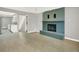 Bright living room with a blue brick fireplace and hardwood floors at 2046 S Quitman St, Denver, CO 80219