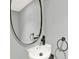 Modern powder room featuring oval mirror and white vanity at 2046 S Quitman St, Denver, CO 80219