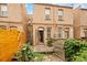 Brick house backyard featuring deck with wooden fence, grill, and natural landscaping at 709 27Th St, Denver, CO 80205