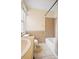 Bathroom showcasing tile flooring, tub, window, and shower with neutral beige walls at 709 27Th St, Denver, CO 80205
