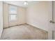 Bedroom with window, carpet, and neutral beige walls in need of repair and flooring at 709 27Th St, Denver, CO 80205