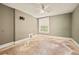Bedroom with ceiling fan, one window, wood floors in need of repair, and neutral walls at 709 27Th St, Denver, CO 80205