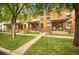 Charming brick townhomes featuring neat front lawns and inviting entrances at 709 27Th St, Denver, CO 80205