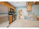 Practical kitchen with stainless steel appliances, light wood cabinets, and tile floors at 709 27Th St, Denver, CO 80205