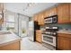 Functional kitchen with stainless steel appliances and white tiled flooring at 709 27Th St, Denver, CO 80205
