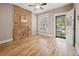 Inviting room featuring an exposed brick accent wall and ample natural light at 709 27Th St, Denver, CO 80205