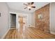 Bright living room with hardwood floors, exposed brick, and staircase access at 709 27Th St, Denver, CO 80205