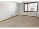 A finished basement featuring wall to wall carpet and a window at 611 E 7Th Ave, Denver, CO 80203