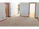 Spacious carpeted bedroom with attached bathroom and laundry area at 611 E 7Th Ave, Denver, CO 80203