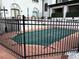 Community pool with a black cover and fence at 611 E 7Th Ave, Denver, CO 80203
