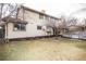 Spacious backyard featuring a well-maintained lawn and a charming deck area, perfect for outdoor entertaining at 1409 S Moline St, Aurora, CO 80012
