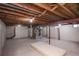 Unfinished basement with exposed ceiling, and room for storage at 1409 S Moline St, Aurora, CO 80012