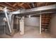 View of the unfinished basement with utilities at 1409 S Moline St, Aurora, CO 80012