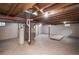 Unfinished basement with water heater and exposed ceiling at 1409 S Moline St, Aurora, CO 80012