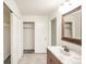 Well-lit bathroom with spacious closet, and tiled floor at 1409 S Moline St, Aurora, CO 80012