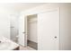 Primary bathroom features a closet, vanity and sink, tile floor, and open closet at 1409 S Moline St, Aurora, CO 80012