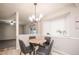 Cozy dining area with chandelier lighting and a view of the backyard at 1409 S Moline St, Aurora, CO 80012