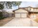 Charming home featuring a two-car garage and a well-manicured front yard at 1409 S Moline St, Aurora, CO 80012