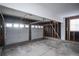 Two car garage features ample room for parking with unfinished walls at 1409 S Moline St, Aurora, CO 80012