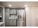 Kitchen boasts stainless steel refrigerator and ample cabinet space for storage at 1409 S Moline St, Aurora, CO 80012