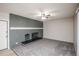 Living room features cozy fireplace with painted brick and ample natural light at 1409 S Moline St, Aurora, CO 80012