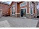 Outdoor patio space with a large stone-designed patio and a sliding glass door at 19414 E Mann Creek Dr # C, Parker, CO 80134