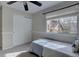 Bedroom with a ceiling fan, closet, window, and a small bed with a decorative pillow at 19414 E Mann Creek Dr # C, Parker, CO 80134