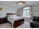 Relaxing primary bedroom with large window and comfortable seating area at 19414 E Mann Creek Dr # C, Parker, CO 80134