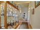 Hallway with display cases and a water fountain at 19414 E Mann Creek Dr # C, Parker, CO 80134