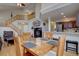 Open-concept living space with stairs, fireplace, and kitchen view at 19414 E Mann Creek Dr # C, Parker, CO 80134