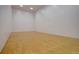 Well-lit racquetball court featuring hardwood floors and pristine white walls at 19414 E Mann Creek Dr # C, Parker, CO 80134