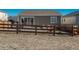 Cozy backyard with sliding glass door, partially enclosed by a charming wooden fence, offering privacy and style at 6317 Vista Cliff Loop, Castle Rock, CO 80104