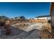 Spacious backyard features gravel landscaping, offering a low-maintenance outdoor area and views of other properties at 6317 Vista Cliff Loop, Castle Rock, CO 80104