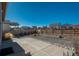 Backyard offers a gravel area with a concrete patio and views of surrounding homes in the community at 6317 Vista Cliff Loop, Castle Rock, CO 80104