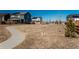 Beautiful community space with walking path surrounded by well-maintained homes with solar panels under a clear blue sky at 6317 Vista Cliff Loop, Castle Rock, CO 80104