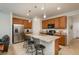 Kitchen features a granite island with bar seating, stainless steel appliances, and ample cabinet space at 6317 Vista Cliff Loop, Castle Rock, CO 80104